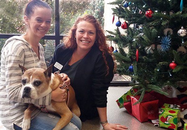 Cancer survivor dog , Addy, with PetCure staff