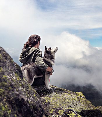 woman and siberian husky dog with cancer